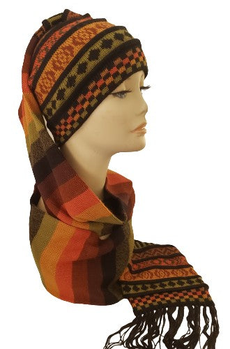 A multicolored black mate green alpaca hat-scarf with a long tail, as a scarf featuring a geometric design