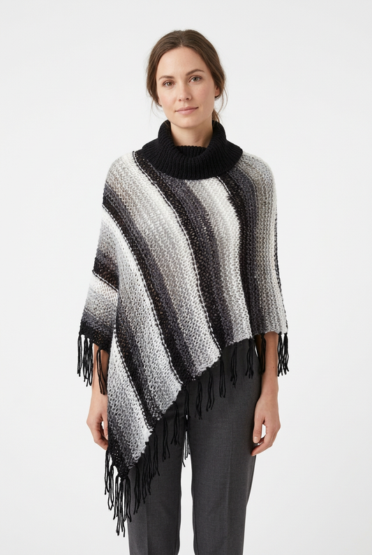 Woman wearing black-and-white asymmetrical poncho front view