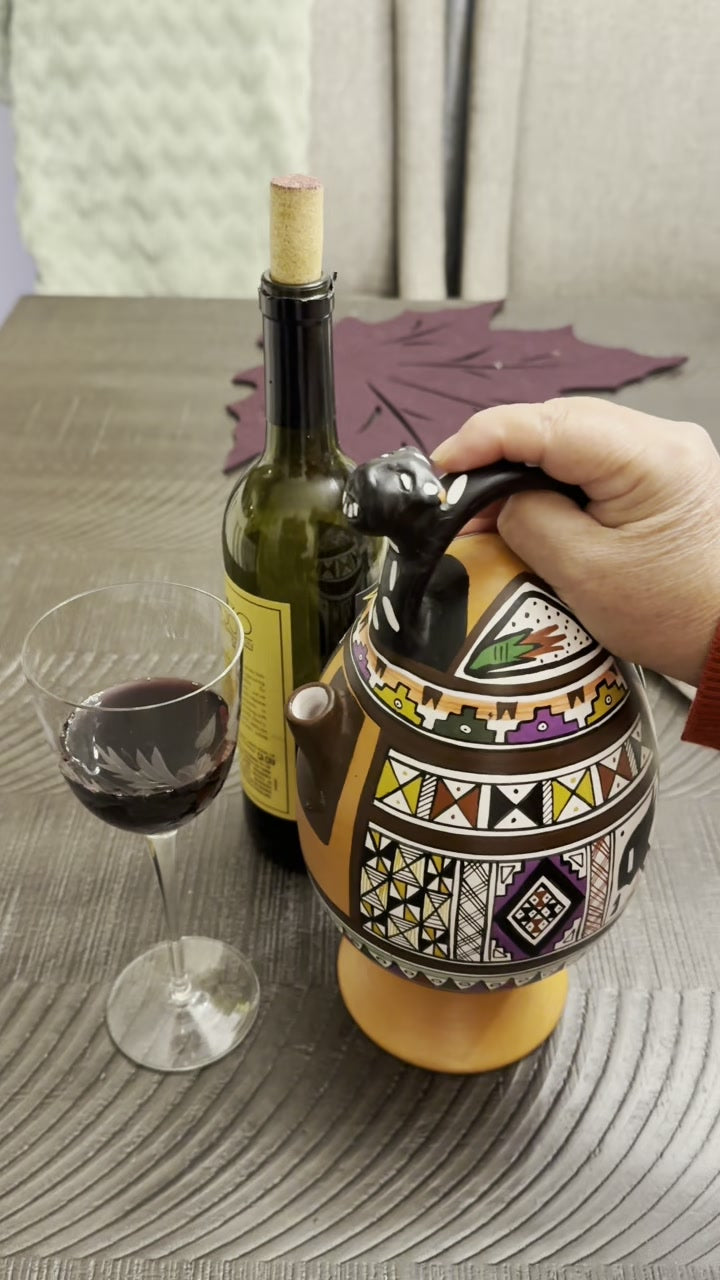 The Peruvian Magic Decanter with a filled glass